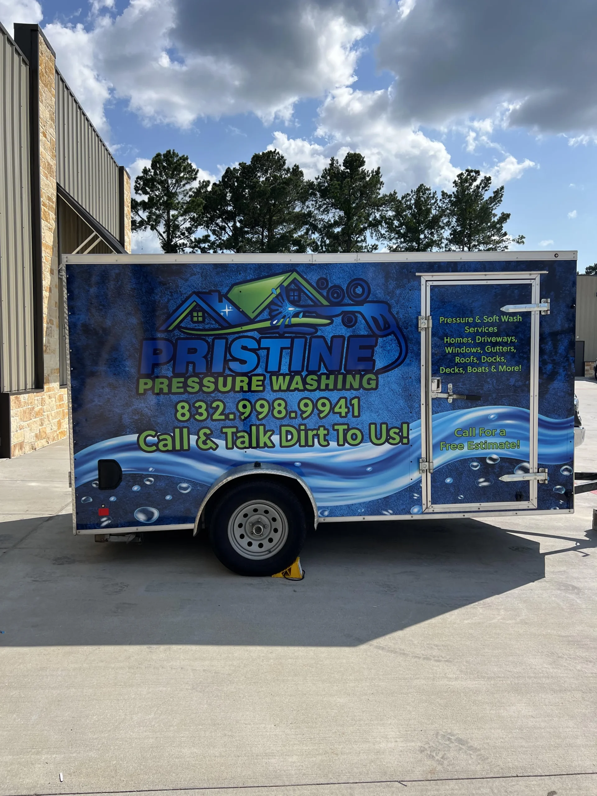 Pristine Pressure Washing branded service trailer parked outside